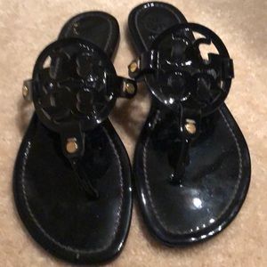 Tory Burch patent leather flat slip on sandal.